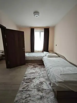 a bedroom with three beds and a window at Къща за гости Савана, Пловдив,Plovdiv, летище Пловдив, Plovdiv Airport,Ягодово in Yagodovo