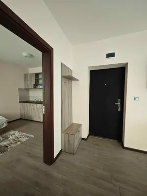 a room with a black door and a wooden floor at Къща за гости Савана, Пловдив,Plovdiv, летище Пловдив, Plovdiv Airport,Ягодово in Yagodovo