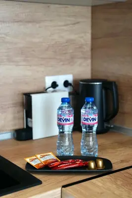 two bottles of water sitting on top of a table at AveNew Luxury Apartment 3 in Sofia