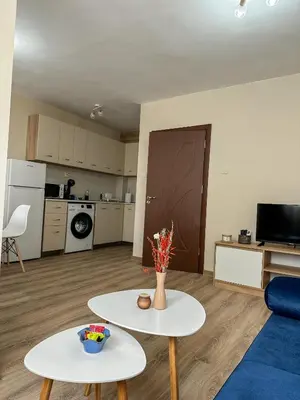 a living room with a couch and a table at Bibi Central Apartment Plovdiv in Plovdiv