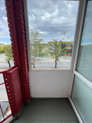 a room with a window with a view of a street at Apartment Iztochen blvd, free parking in Plovdiv