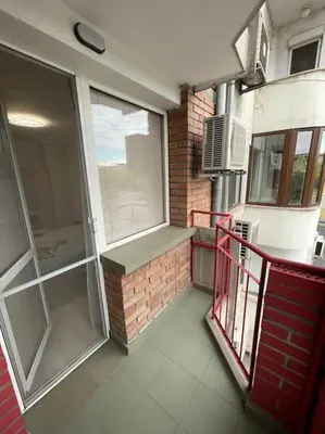 a balcony of a house with a red railing at Apartment Iztochen blvd, free parking in Plovdiv
