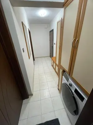 a bathroom with a washing machine in a room at Apartment Iztochen blvd, free parking in Plovdiv