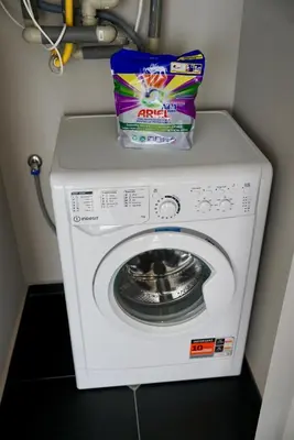 a washer and dryer with a bag on top of it at AveNew Luxury Apartment 2 in Sofia