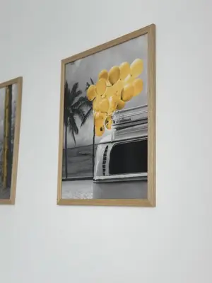 a picture of a bunch of yellow balloons in a frame at 1BD Flat near Maritsa river and City Center in Plovdiv