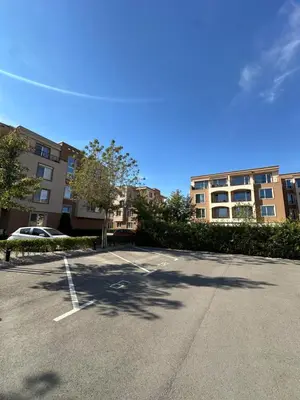 an empty parking lot with a building in the background at 1BD Flat near Maritsa river and City Center in Plovdiv