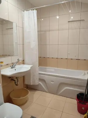 a bathroom with a sink and a tub and a toilet at ТОП Локация и УЮТ in Bansko