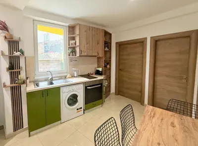 a kitchen with a sink and a washing machine at Center Apartments The Quiet Luxury 1 in Plovdiv
