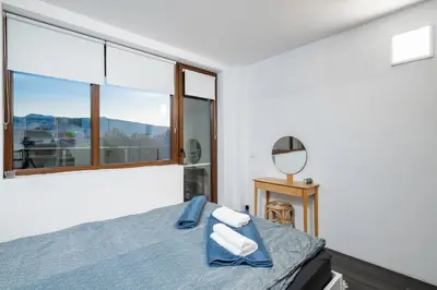 a bedroom with a bed and a mirror at Cozy 1BD Flat Close to the City Center by Flat Mаnager in Sofia