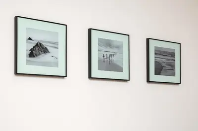 a group of four framed pictures on a wall at Cozy and comfortable northern apartment, Kapana district, Plovdiv, Center in Plovdiv