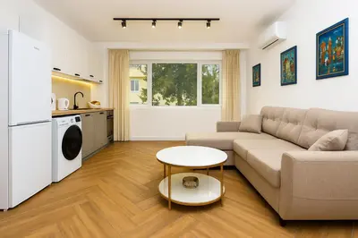 a living room with a couch and a table at Cozy and comfortable southern apartment, Kapana district, Plovdiv, Center in Plovdiv