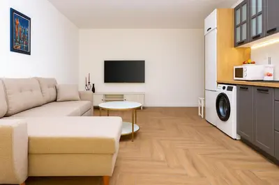 a living room with a couch and a table at Cozy and comfortable southern apartment, Kapana district, Plovdiv, Center in Plovdiv
