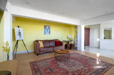 a living room with a couch and a table at Best Views from Top Central Cozy 1-Bedroom Flat by Flat Mаnager in Sofia