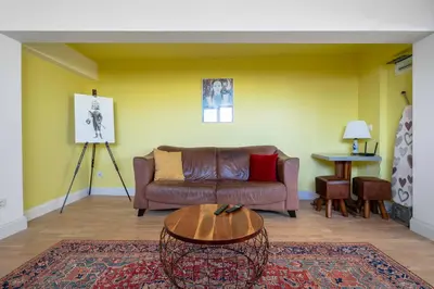 a living room with a couch and a table at Best Views from Top Central Cozy 1-Bedroom Flat by Flat Mаnager in Sofia