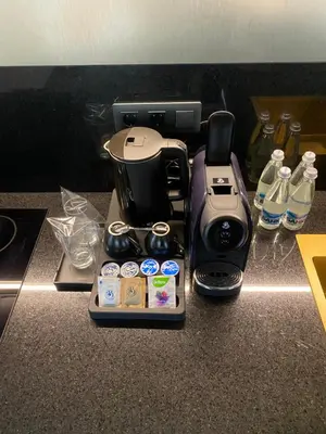 a counter top with a coffee maker and a blender at Hotel Royal Plovdiv in Plovdiv