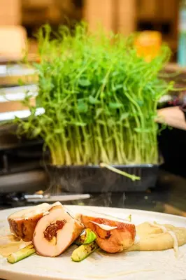 a plate of food with vegetables on a table at Hotel Royal Plovdiv in Plovdiv