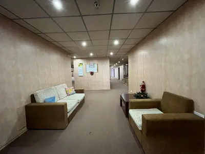 a hallway with couches and tables in a building at Luxury flat F218 in Bansko