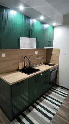 a kitchen with green cabinets and a sink at Luxury flat F218 in Bansko