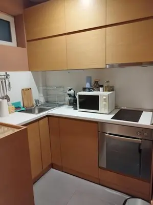 a kitchen with a microwave and a sink at The Cathedral in Sofia