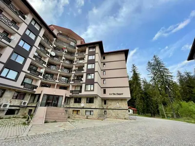 a large apartment building with a lot of windows at Комплекс Свети Георги in Pamporovo