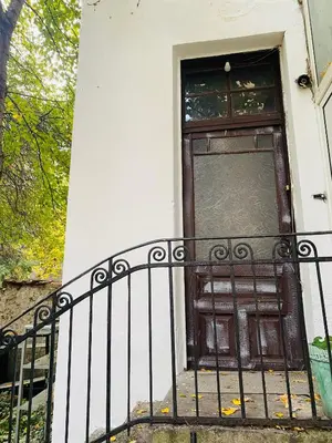 a door on a building with a fence at Escape in photos in top centre apartment in Sofia