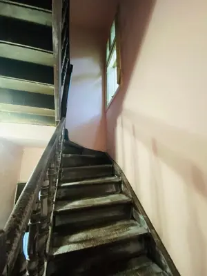 a staircase in an old building with a window at Escape in photos in top centre apartment in Sofia