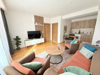 a living room with a couch and a table at Central 2 Bedroom Apartments The Quiet Luxury 3 in Plovdiv