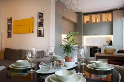 a living room with a table with wine glasses at NEW Glamours Central Suite with Elevator in Sofia