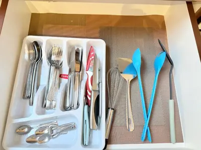 a drawer filled with utensils in a box at Center Apartments The Quiet Luxury 5 in Plovdiv
