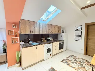 a kitchen with a sink and a washing machine at Center Apartments The Quiet Luxury 5 in Plovdiv