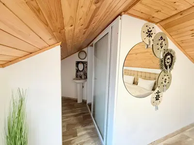 a room with a door and a mirror at Center Apartments The Quiet Luxury 7 in Plovdiv