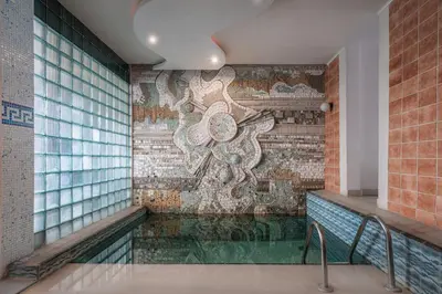 a wall with a mosaic mural in a building at Balneocomplex Kamena in Velingrad