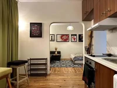 a room with a kitchen and a living room at Cultural Retreat in Sofia in Sofia