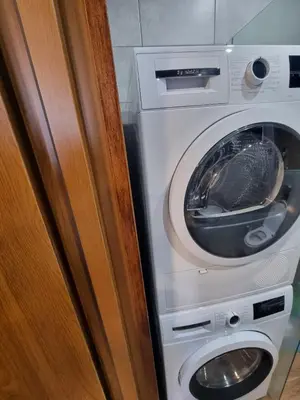 a washing machine sitting next to a washer at Studio Todorka in Bansko