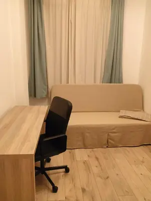 a bedroom with a desk and a bed and a chair at My place in Sofia - Top center - 2 bedrooms - Self check-in in Sofia