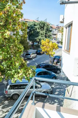 a balcony with cars parked in a parking lot at Sweet Home 2 in Sandanski