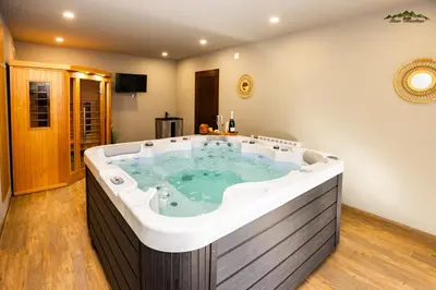 a jacuzzi tub in a house at Villa Malevitsa Вила Малевица in Relyovo