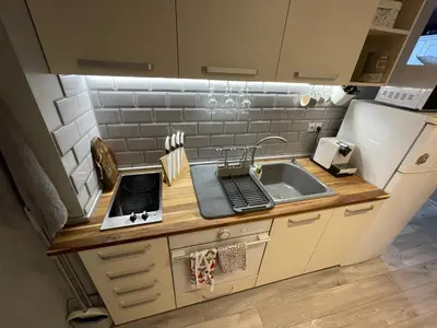 a small kitchen with a sink and a stove at Castle Studio 203 Pamporovo in Pamporovo