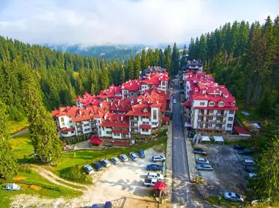 an aerial view of a resort town with red roofs at Castle Studio 203 Pamporovo in Pamporovo