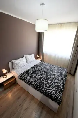 a bedroom with a bed and a window at INB Banishora spot 9 in Sofia