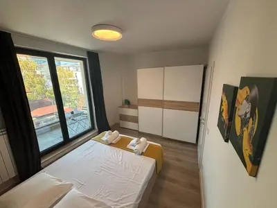 a small room with a bed and a window at Turquoise City Exotic Bliss in Sofia