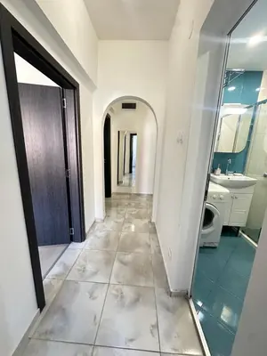 a hallway of a bathroom with a sink and a mirror at Lions Bridge C-E-N-T-R-A-L in Sofia