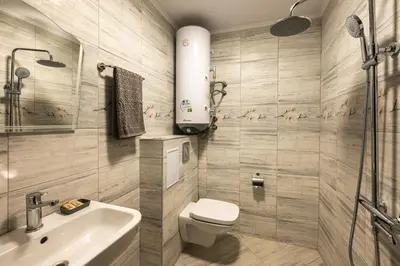 a bathroom with a toilet and a sink at Комплекс Стадиона in Velingrad