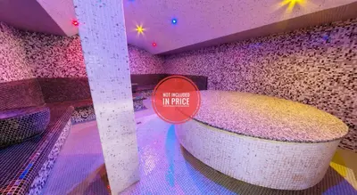 a bath tub in a room with a sign on it at Belvedere 1Bedroom Apartment with Kitchen in Bansko