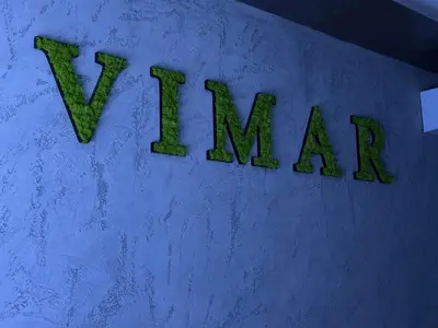 a sign that says v man on a wall at Vimar Apartments in Panagyurishte
