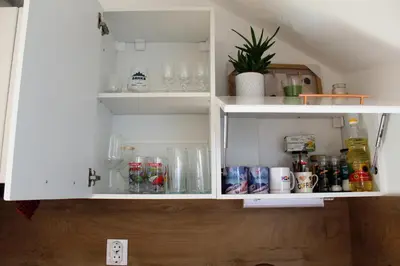 a white cabinet with drinks and other items in it at One bedroom ap 602 IN RILA PARK for 6 people in Borovets