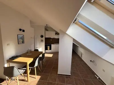 a kitchen and dining room with a table and chairs at One bedroom ap 602 IN RILA PARK for 6 people in Borovets