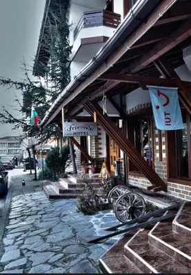 a building with signs on the side of it at Luxury Studio1 in Hotel Friends in Bansko