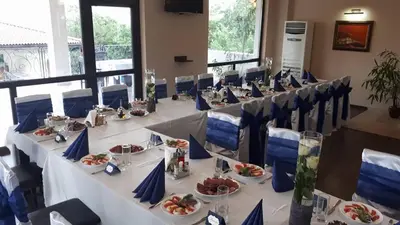 a group of tables with plates of food on them at Вила Белисима, Villa Bellissima in Kara Agach