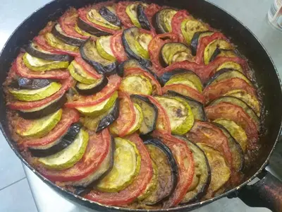 a pan filled with zucchini and other vegetables at Вила Белисима, Villa Bellissima in Kara Agach